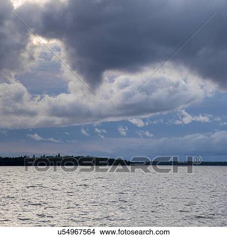 Picture - Clouds over the lake, Lake Winnipeg, Riverton, Hecla Grindstone Provincial Park, Manitoba, Canada. Fotosearch