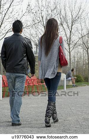 Couple walking in a public park, Olympic Sculpture Park, Seattle, Washington State, USA View Large Photo Image Stock Image - Couple walking in a public park, Olympic Sculpture Park, Seattle, Washington State, USA. Fotosearch