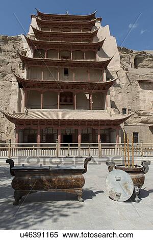 Stock Photography - Facade of the Mogao Caves, Dunhuang, Jiuquan, Gansu Province, China. Fotosearch