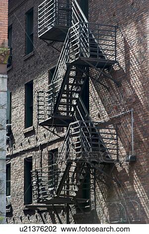 Stock Image - Fire escape on exterior of a building, Pioneer Square, Seattle, Washington State, USA. Fotosearch