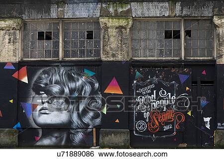 Stock Photograph - Giant mural posters on a street, Pioneer Square, Seattle, Washington State, USA. Fotosearch
