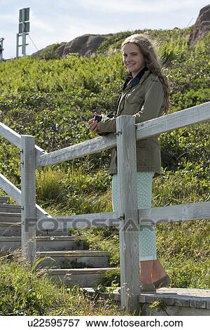 Girl at Cape Spear, St. John's, Newfoundland And Labrador, Canada View Large Photo Image Stock Photo - Girl at Cape Spear, St. John's, Newfoundland And Labrador, Canada. Fotosearch