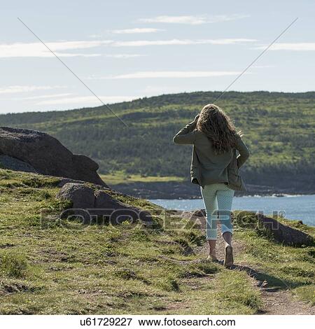 Girl walking at coast, Cape Spear, St. John's, Newfoundland And Labrador, Canada View Large Photo Image Stock Photo - Girl walking at coast, Cape Spear, St. John's, Newfoundland And Labrador, Canada. Fotosearch