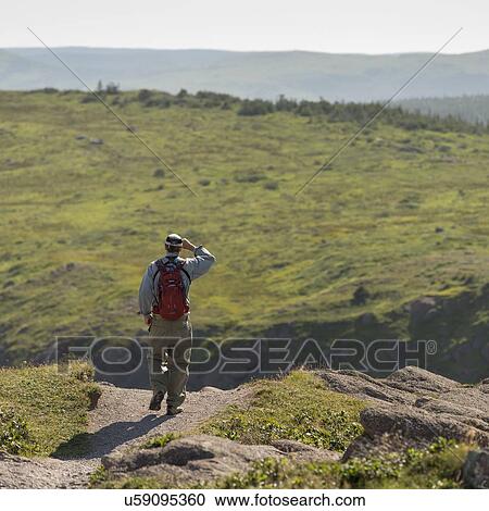 Hiker at Cape Spear, St. John's, Newfoundland And Labrador, Canada View Large Photo Image Stock Image - Hiker at Cape Spear, St. John's, Newfoundland And Labrador, Canada. Fotosearch
