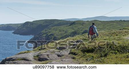 Hiker at coast, Cape Spear, St. John's, Newfoundland And Labrador, Canada View Large Photo Image Stock Photo - Hiker at coast, Cape Spear, St. John's, Newfoundland And Labrador, Canada. Fotosearch