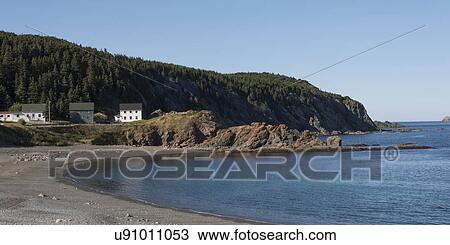 Stock Image - Houses along coastline, Twillingate, North Twillingate Island, Newfoundland And Labrador, Canada. Fotosearch