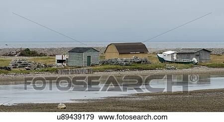 Stock Photo - Houses along the coast, Parson's Pond, Gros Morne National Park, Newfoundland And Labrador, Canada. Fotosearch