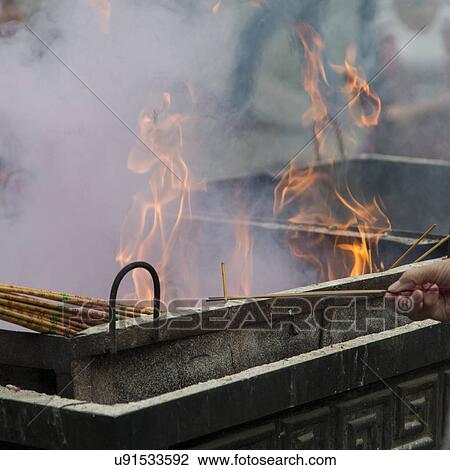 Stock Image - Incense sticks burning at a temple, Lama Temple, Dongcheng, Beijing, China. Fotosearch