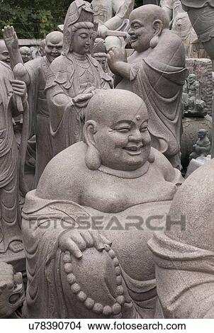 Picture - Laughing Buddha statues in Panjiayuan antique market, Beijing, China. Fotosearch