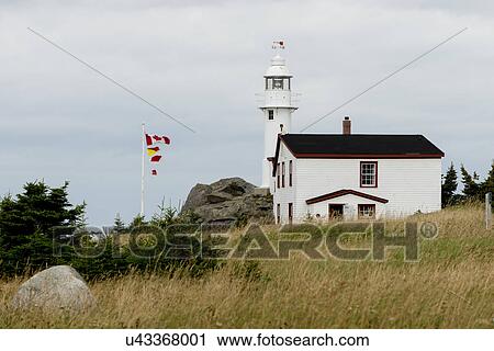 Stock Image - Lobster Cove Head Lighthouse, Rocky Harbor, Gros Morne National Park, Newfoundland And Labrador, Canada. Fotosearch