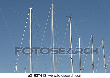 Low angle view of sailboat masts, Riverton, Hecla Grindstone Provincial Park, Manitoba, Canada View Large Photo Image Stock Image - Low angle view of sailboat masts, Riverton, Hecla Grindstone Provincial Park, Manitoba, Canada. Fotosearch