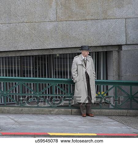 Stock Photo - Man leaning against the railing, Seattle, Washington State, USA. Fotosearch