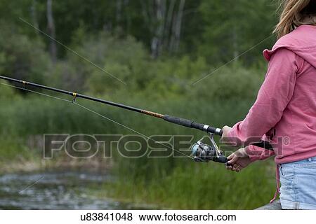 Mid section view of a girl fishing, Riding Mountain National Park, Manitoba, Canada View Large Photo Image Stock Photo - Mid section view of a girl fishing, Riding Mountain National Park, Manitoba, Canada. Fotosearch
