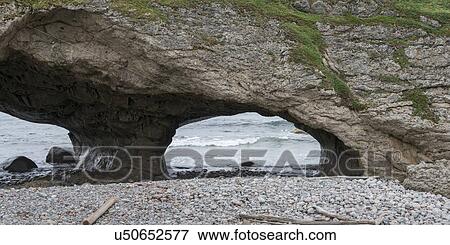 Stock Photo - Natural arch formation at coast, Portland Creek, Gros Morne National Park, Newfoundland And Labrador, Canada. Fotosearch