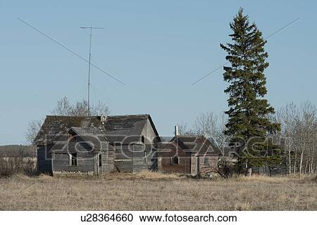 Old abandoned buildings on a field, Manitoba, Canada View Large Photo Image Stock Image - Old abandoned buildings on a field, Manitoba, Canada. Fotosearch
