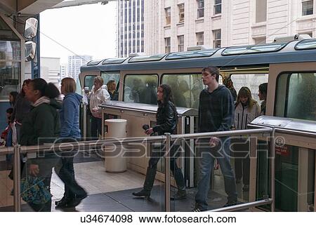 Stock Photo - Passengers walking out of a monorail, Seattle Center, Seattle, Washington State, USA. Fotosearch