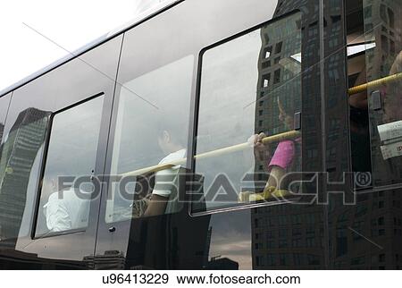 People traveling by bus, Beijing, China View Large Photo Image Stock Photo - People traveling by bus, Beijing, China. Fotosearch