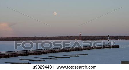 Stock Image - Pier on a frozen lake, Lake Winnipeg, Riverton, Hecla Grindstone Provincial Park, Manitoba, Canada. Fotosearch