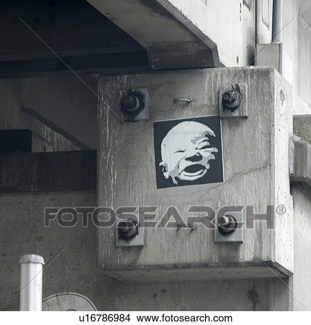 Picture - Poster of a face on a concrete block, Seattle, Washington State, USA. Fotosearch