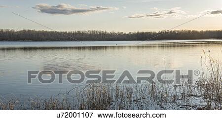 Reflection of clouds in a lake, Manitoba, Canada View Large Photo Image Stock Photo - Reflection of clouds in a lake, Manitoba, Canada. Fotosearch