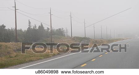 Stock Photo - Road in mist, Newfoundland And Labrador, Canada. Fotosearch