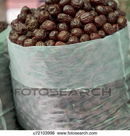 Sack of dried fruits in market, Dong Dajie, Dunhuang, Jiuquan, Gansu Province, China View Large Photo Image Stock Photo - Sack of dried fruits in market, Dong Dajie, Dunhuang, Jiuquan, Gansu Province, China. Fotosearch