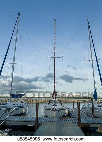 Stock Photograph - Sailboats moored at a harbor, Lake Winnipeg, Riverton, Hecla Grindstone Provincial Park, Manitoba, Canada. Fotosearch