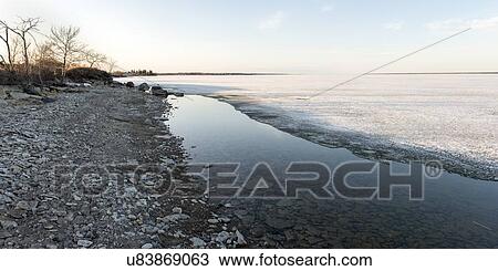 Shoreline of Frozen lake in winter, Lake Winnipeg, Hecla Grindstone Provincial Park, Manitoba, Canada View Large Photo Image Stock Image - Shoreline of Frozen lake in winter, Lake Winnipeg, Hecla Grindstone Provincial Park, Manitoba, Canada. Fotosearch