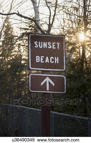 Stock Photo - Sign board of Sunset Beach, Hecla Grindstone Provincial Park, Manitoba, Canada. Fotosearch