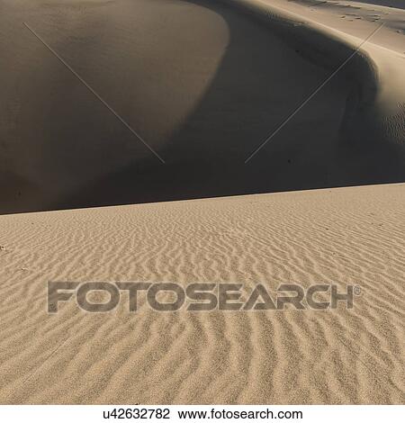 Singing sand dunes at Mingsha Shan, Gobi Desert, Dunhuang, Jiuquan, Gansu Province, China View Large Photo Image Stock Image - Singing sand dunes at Mingsha Shan, Gobi Desert, Dunhuang, Jiuquan, Gansu Province, China. Fotosearch