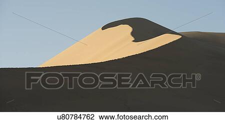 Singing sand dunes at Mingsha Shan, Gobi Desert, Dunhuang, Jiuquan, Gansu Province, China View Large Photo Image Stock Image - Singing sand dunes at Mingsha Shan, Gobi Desert, Dunhuang, Jiuquan, Gansu Province, China. Fotosearch
