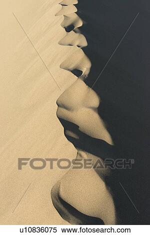 Stock Photography - Singing sand dunes at Mingsha Shan, Gobi Desert, Dunhuang, Jiuquan, Gansu Province, China. Fotosearch