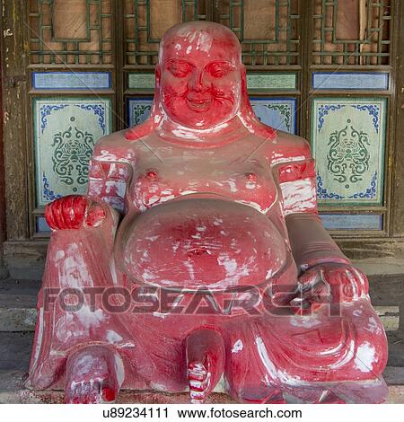 Stock Image - Statue of Buddha in the Lei Yinsi Temple, Dunhuang, Jiuquan, Gansu Province, China. Fotosearch
