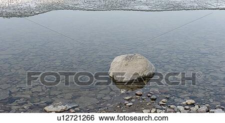 Stock Photograph - Stones along shoreline of Lake Winnipeg, Hecla Grindstone Provincial Park, Manitoba, Canada. Fotosearch