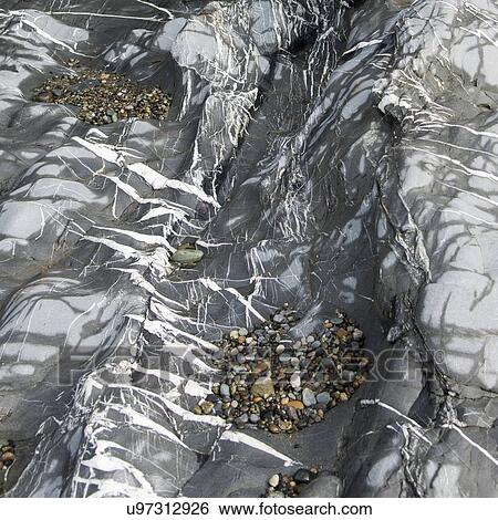 Stock Photograph - Stones and pebbles on the rocks, Deception Pass State Park, Oak Harbor, Washington State, USA. Fotosearch