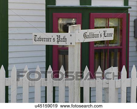 Stock Photo - Street name signs on picket fence, Trinity, Bonavista Peninsula, Newfoundland And Labrador, Canada. Fotosearch