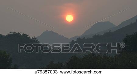 Sunrise over mountain range, Miyun County, Beijing, China View Large Photo Image Stock Image - Sunrise over mountain range, Miyun County, Beijing, China. Fotosearch