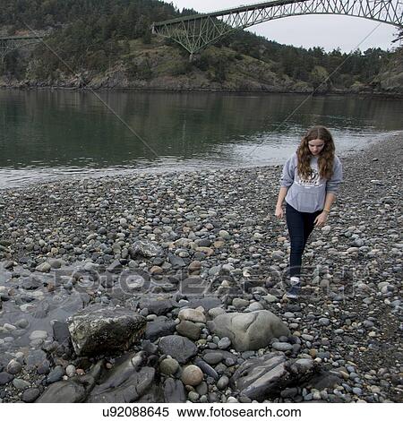Stock Photography - Teenage girl at the lakeside, Deception Pass State Park, Oak Harbor, Washington State, USA. Fotosearch