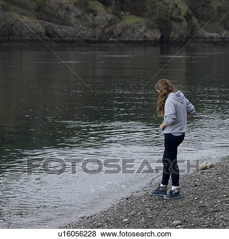 Teenage girl standing at the lakeside, Deception Pass State Park, Oak Harbor, Washington State, USA View Large Photo Image Stock Photo - Teenage girl standing at the lakeside, Deception Pass State Park, Oak Harbor, Washington State, USA. Fotosearch