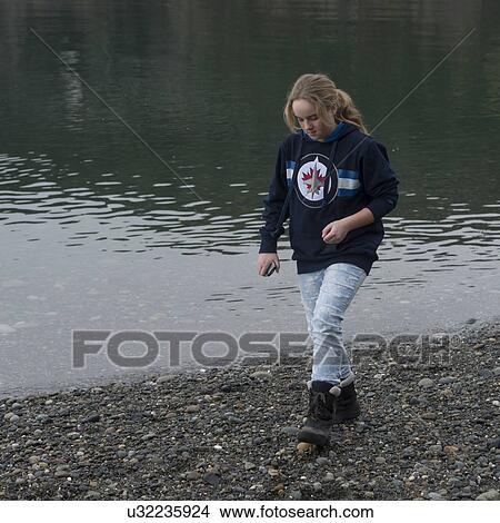 Teenage girl walking at the lakeside, Deception Pass State Park, Oak Harbor, Washington State, USA View Large Photo Image Picture - Teenage girl walking at the lakeside, Deception Pass State Park, Oak Harbor, Washington State, USA. Fotosearch