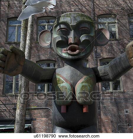 Totem pole in front of a building, Occidental Park, Pioneer Square, Seattle, Washington State, USA View Large Photo Image Stock Image - Totem pole in front of a building, Occidental Park, Pioneer Square, Seattle, Washington State, USA. Fotosearch