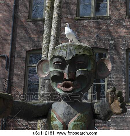 Totem pole in front of a building, Occidental Park, Pioneer Square, Seattle, Washington State, USA View Large Photo Image Stock Image - Totem pole in front of a building, Occidental Park, Pioneer Square, Seattle, Washington State, USA. Fotosearch