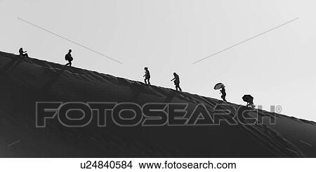 Picture - Tourists at Mingsha Shan, Dunhuang, Jiuquan, Gansu Province, China. Fotosearch