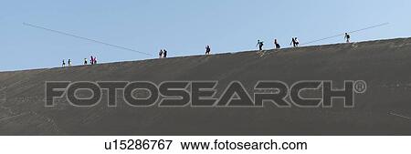 Stock Photo - Tourists at Mingsha Shan, Dunhuang, Jiuquan, Gansu Province, China. Fotosearch