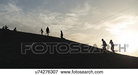 Stock Photo - Tourists at Mingsha Shan, Dunhuang, Jiuquan, Gansu Province, China. Fotosearch