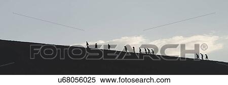 Stock Photography - Tourists at Mingsha Shan, Dunhuang, Jiuquan, Gansu Province, China. Fotosearch