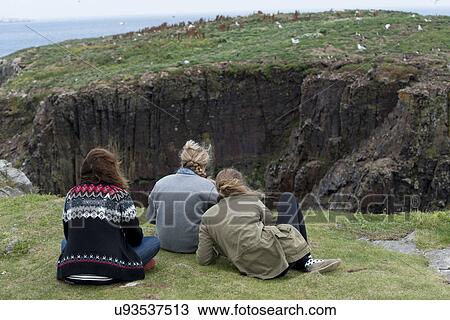 Stock Image - Tourists at North Bird Island, Little Catalina, Bonavista Peninsula, Newfoundland And Labrador, Canada. Fotosearch