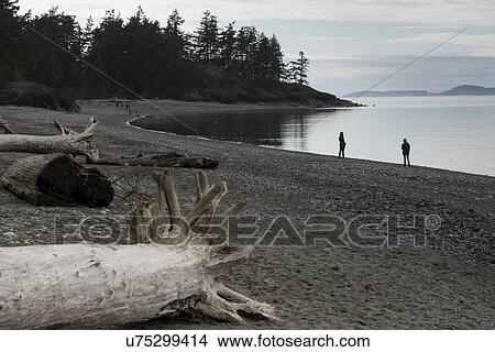 Tourists at the lakeside, Deception Pass State Park, Oak Harbor, Washington State, USA View Large Photo Image Picture - Tourists at the lakeside, Deception Pass State Park, Oak Harbor, Washington State, USA. Fotosearch