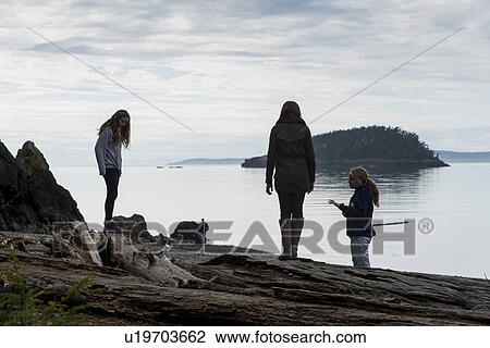Tourists at the lakeside, Deception Pass State Park, Oak Harbor, Washington State, USA View Large Photo Image Stock Image - Tourists at the lakeside, Deception Pass State Park, Oak Harbor, Washington State, USA. Fotosearch