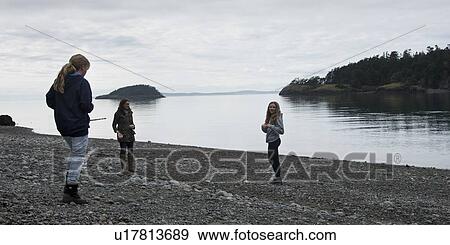 Tourists at the lakeside, Deception Pass State Park, Oak Harbor, Washington State, USA View Large Photo Image Stock Photo - Tourists at the lakeside, Deception Pass State Park, Oak Harbor, Washington State, USA. Fotosearch
